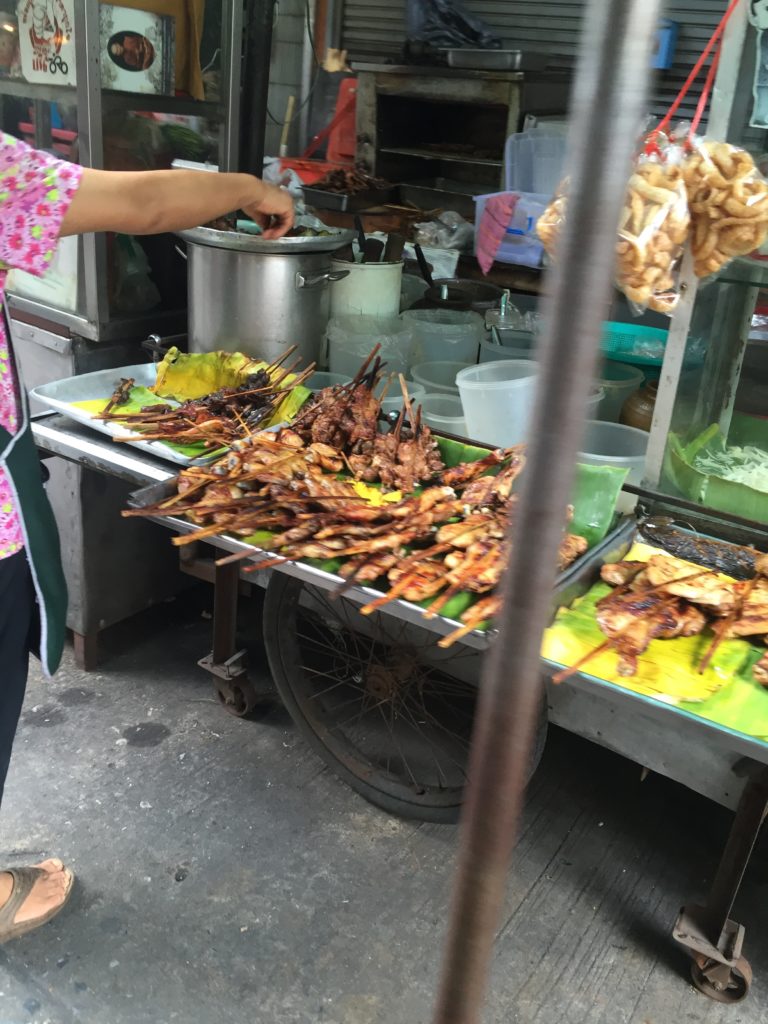 Grilled chicken is a common staple sold on the streets of Bangkok...