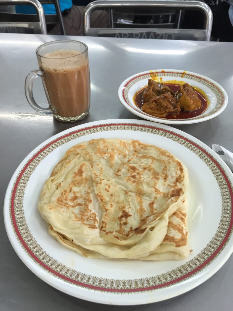 Roti paratha, chicken curry and hot ginger tea with milk...
