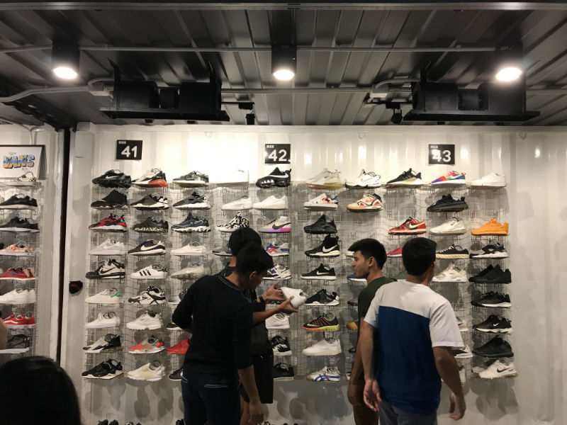 Shoe shop selling brand name sneakers inside JJ Green 2 Night Market