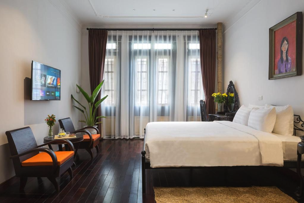 Guest room at Centraltique Downtown - Bespoke Colonial House Near Hoan Kiem Lake